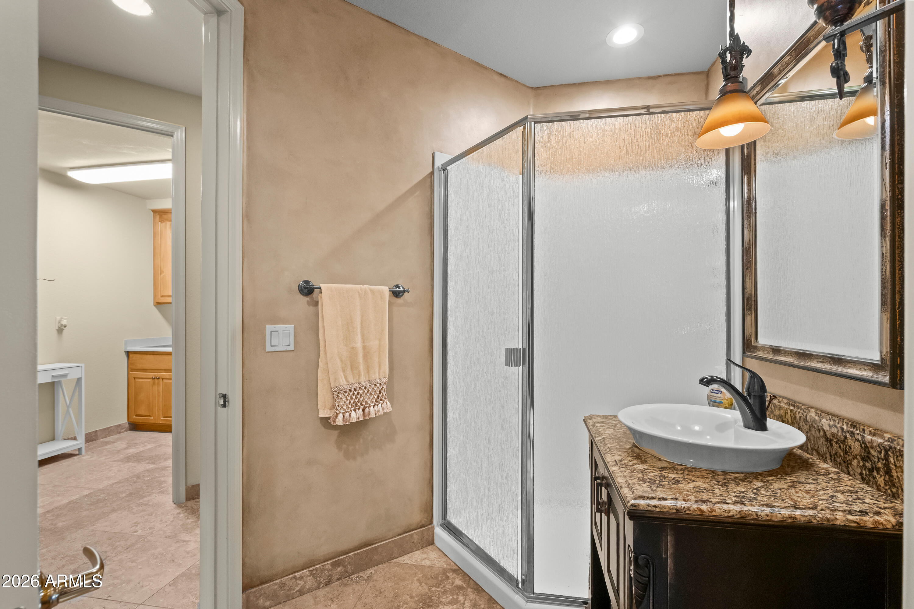 18513 East Agua Verde Drive Rio Verde, AZ 85263 - Photo 32 of 42 a bathroom with a granite countertop shower sink and mirror