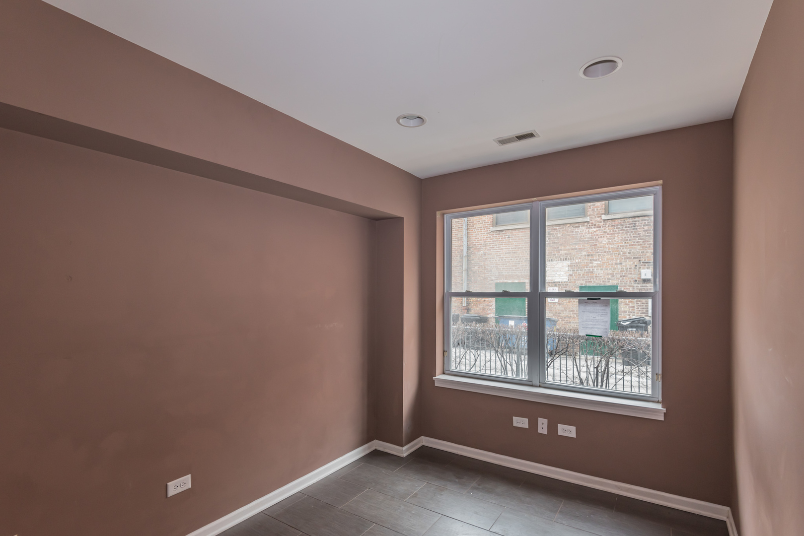 16 South Aberdeen Street, Unit 9 Chicago, IL 60607 - Photo 14 of 24 a view of an empty room with a window