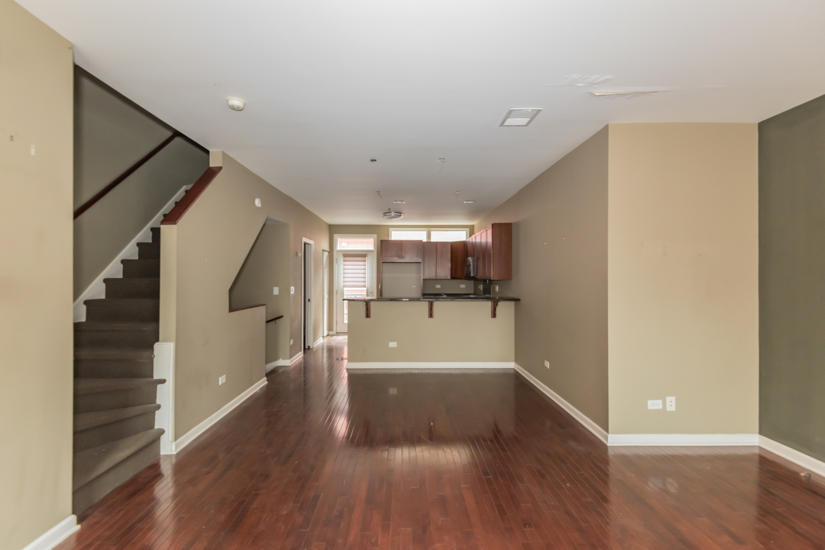 16 South Aberdeen Street, Unit 9 Chicago, IL 60607 - Photo 8 of 24 a view of a hallway with wooden floor and staircase