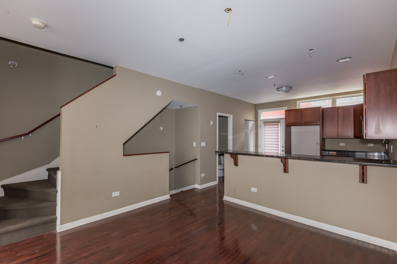 16 South Aberdeen Street, Unit 9 Chicago, IL 60607 - Photo 9 of 24 a view of a kitchen with a sink and a refrigerator