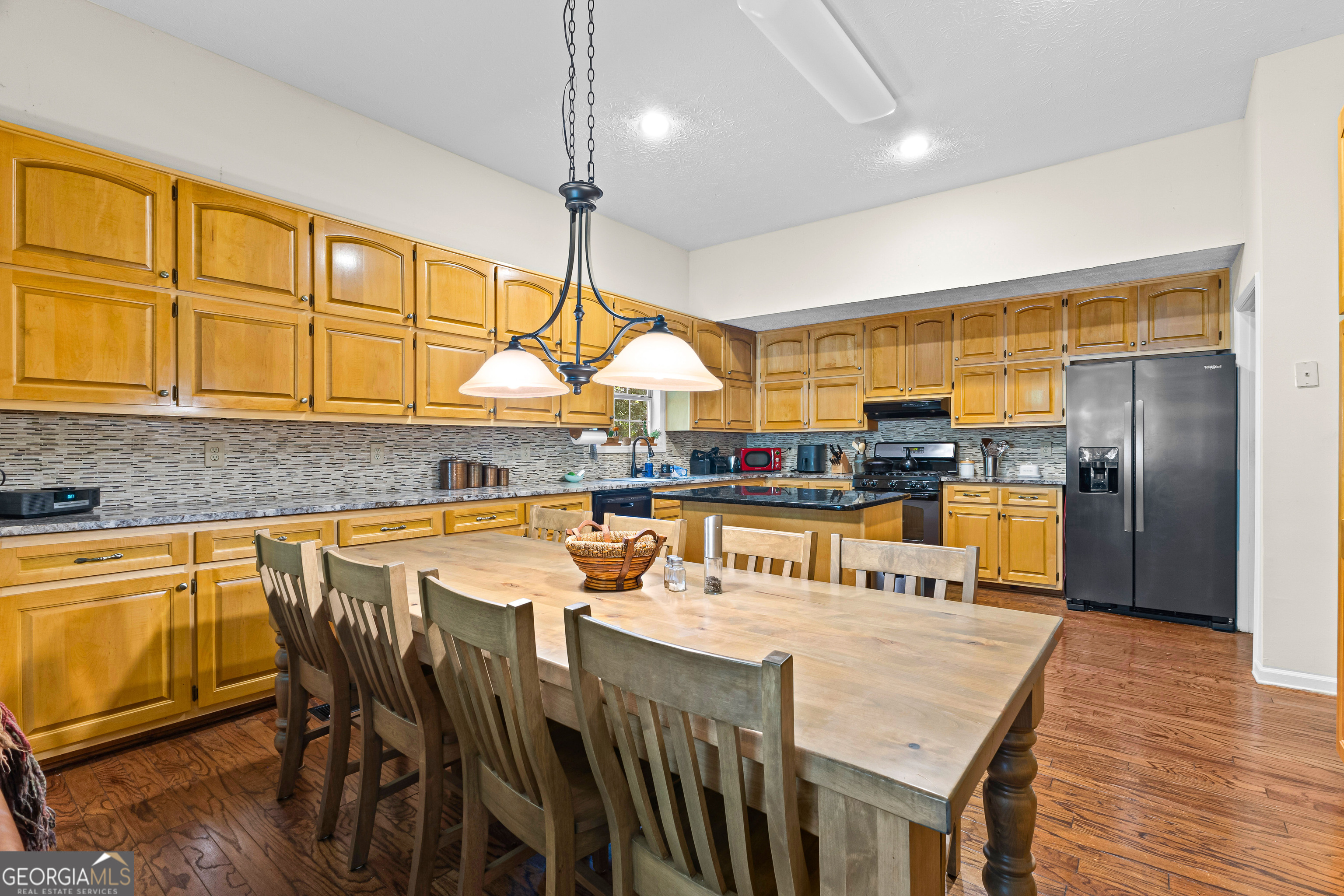 65 Pointe View Court Jackson, GA 30233 - Photo 11 of 39 a kitchen with stainless steel appliances granite countertop a sink a stove and a refrigerator