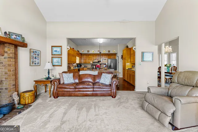 a living room with furniture and a table