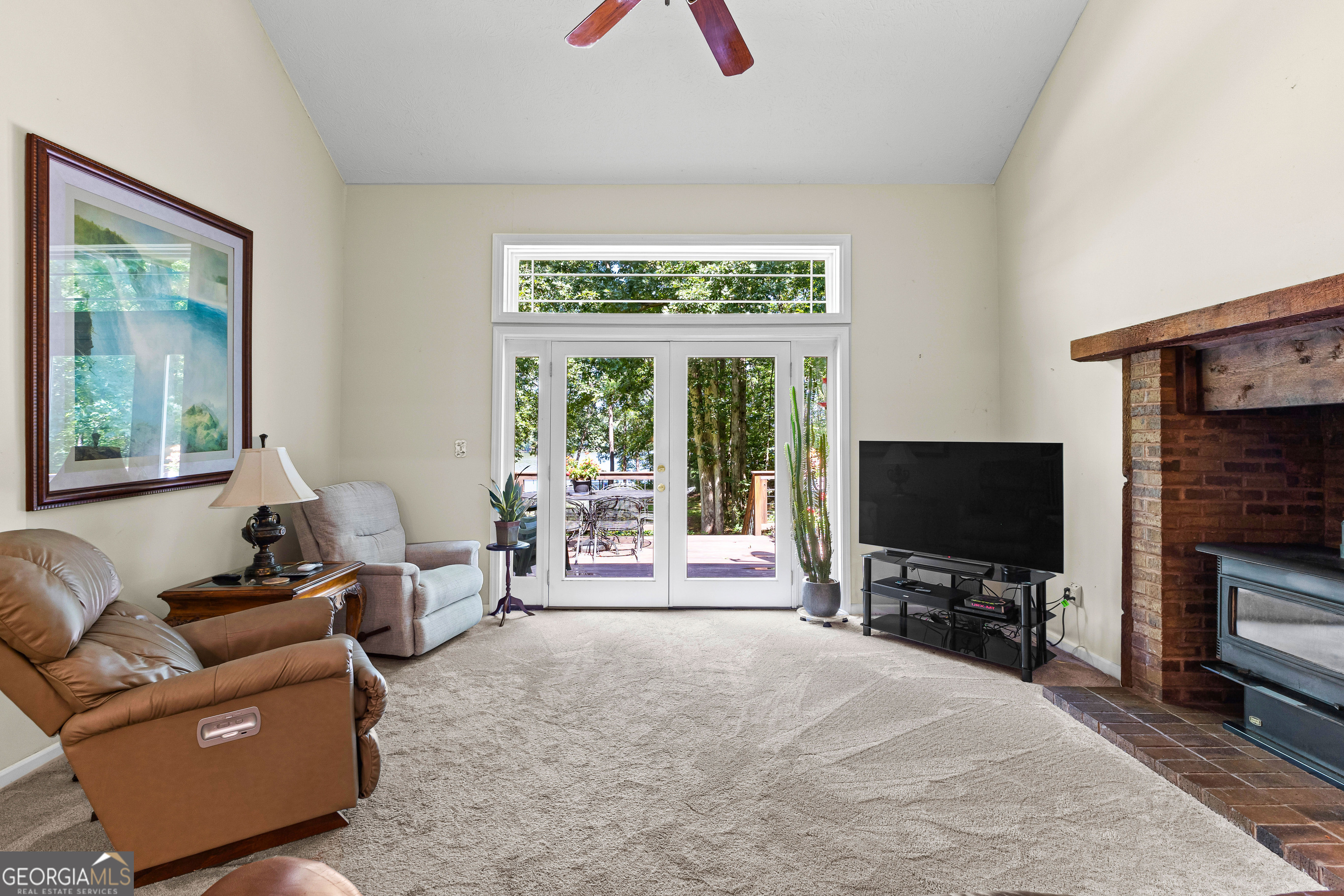65 Pointe View Court Jackson, GA 30233 - Photo 14 of 39 a living room with furniture and a flat screen tv