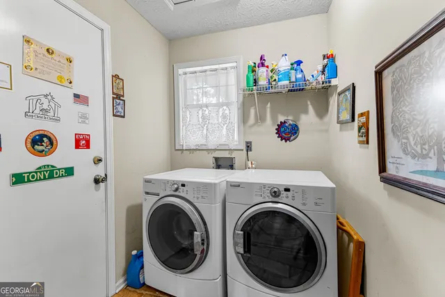 a utility room with a window dryer and washer