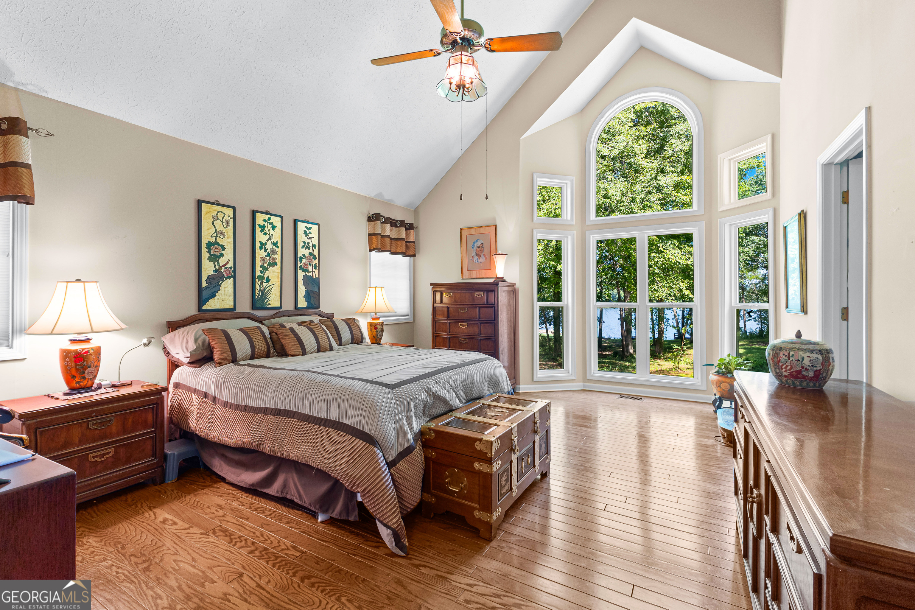 65 Pointe View Court Jackson, GA 30233 - Photo 17 of 39 a spacious bedroom with a bed and a large window