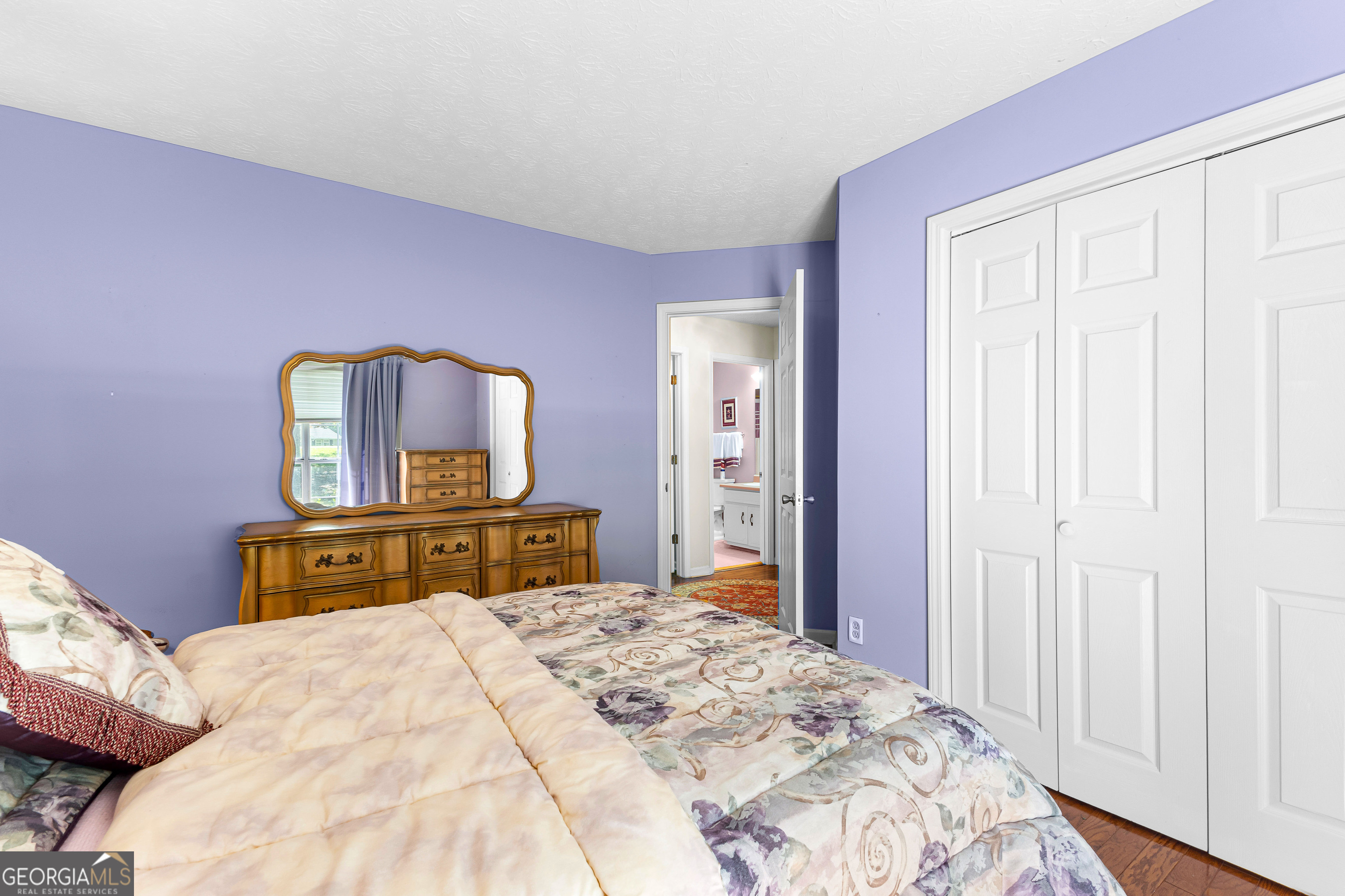 65 Pointe View Court Jackson, GA 30233 - Photo 24 of 39 a bedroom with a bed and a dresser