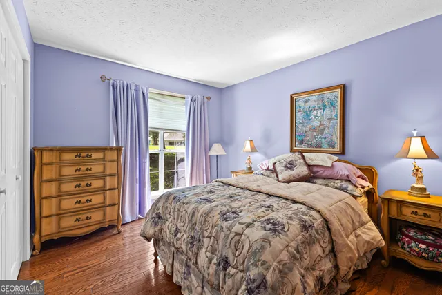 a bedroom with a bed and a closet