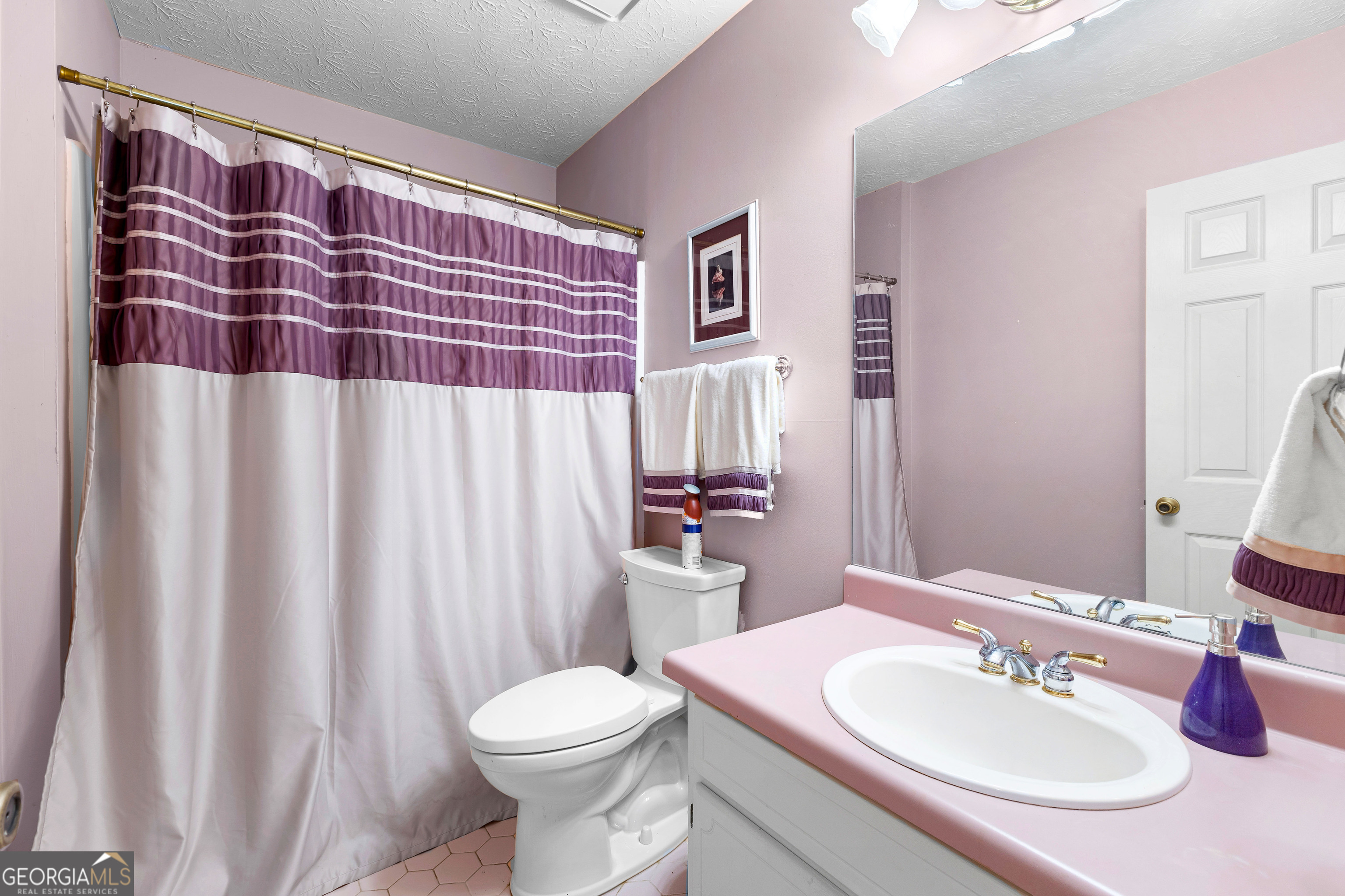 65 Pointe View Court Jackson, GA 30233 - Photo 26 of 39 a bathroom with a sink and a mirror