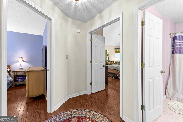 a view of a bedroom from a hallway