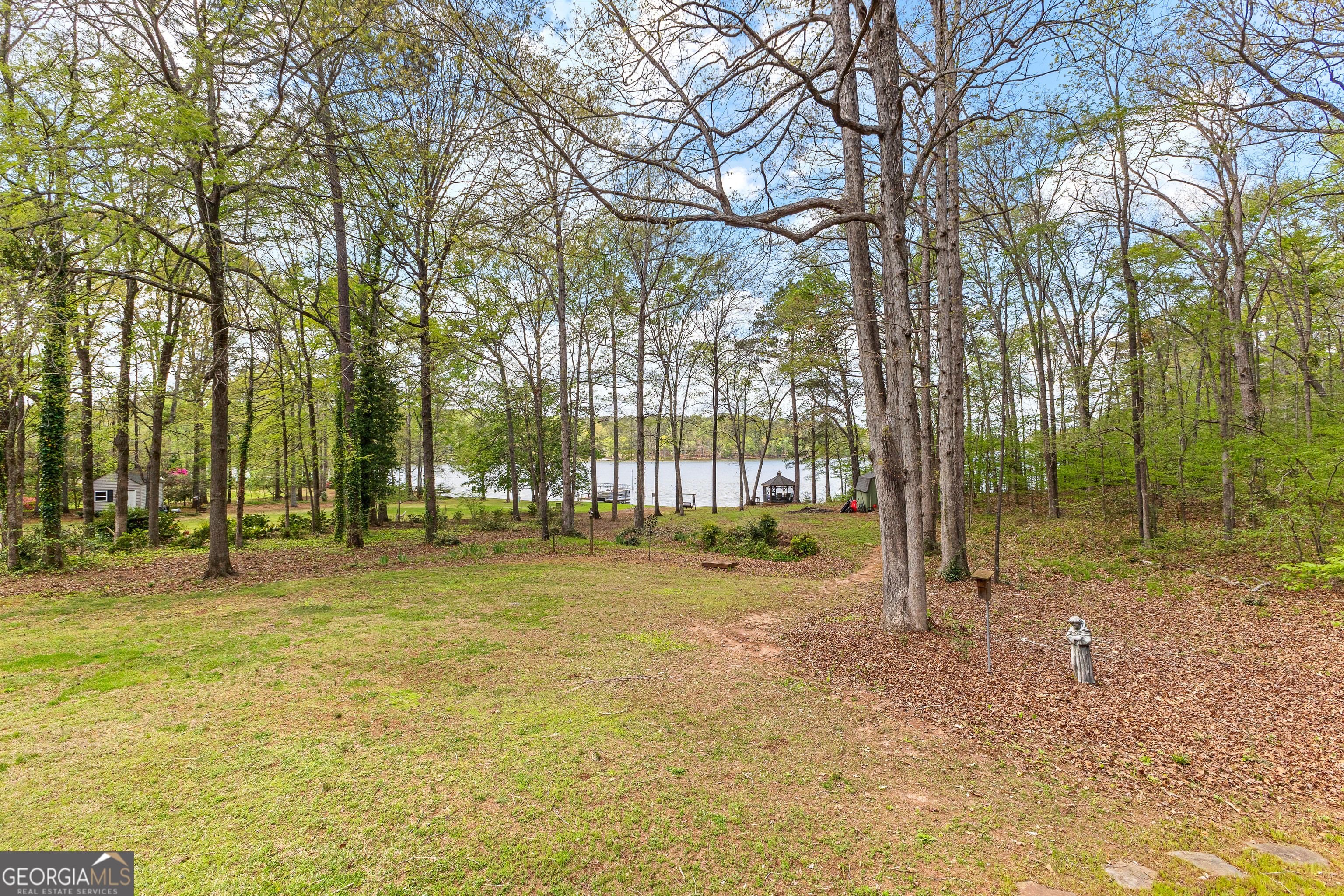65 Pointe View Court Jackson, GA 30233 - Photo 30 of 39 a swimming pool with trees in the background