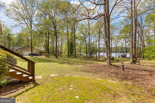 a view of a yard with swimming pool