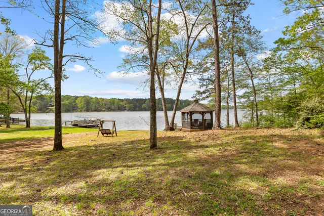 a large building with trees in the background