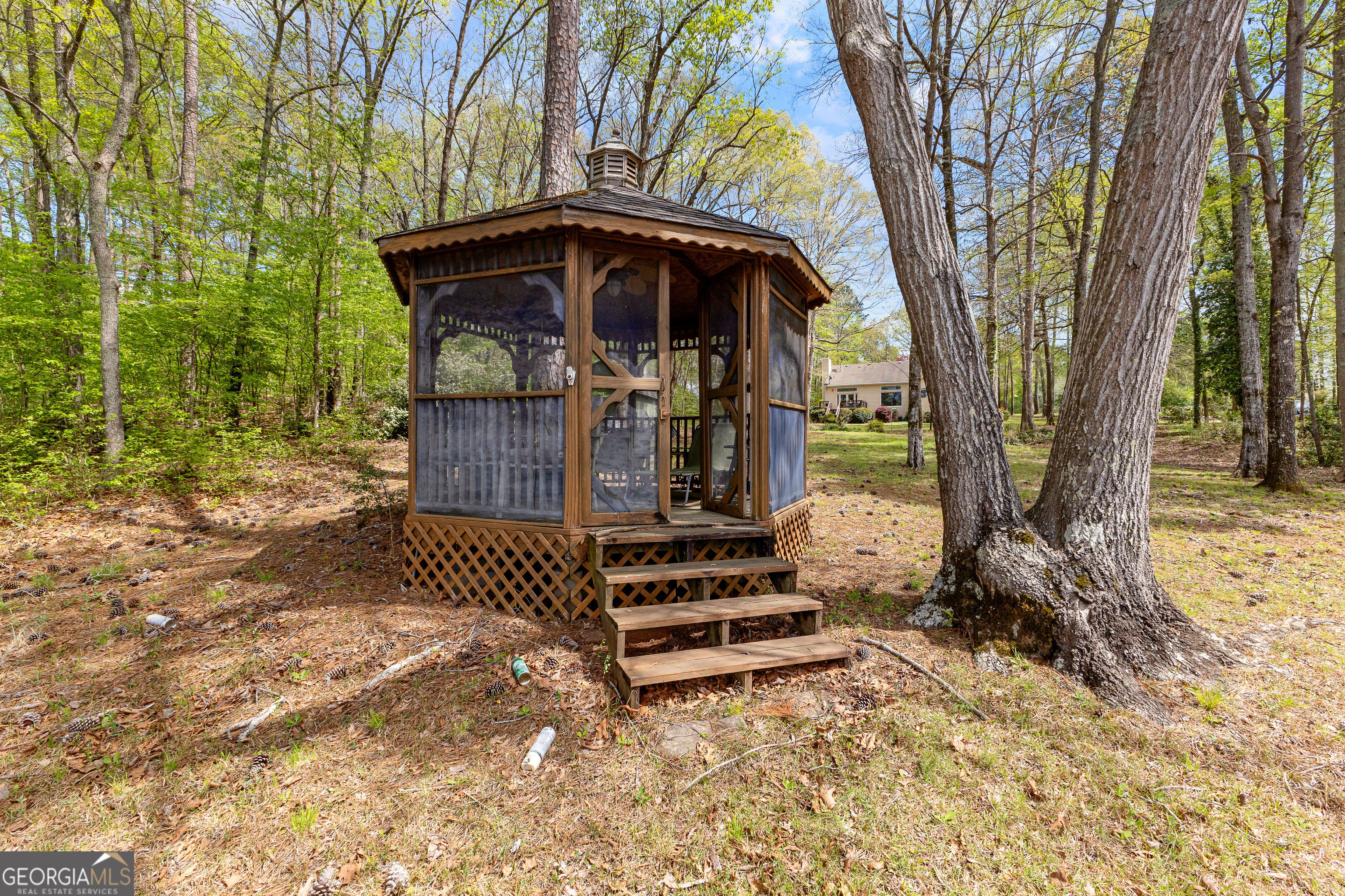 65 Pointe View Court Jackson, GA 30233 - Photo 33 of 39 a view of a yard with wooden fence and a large tree