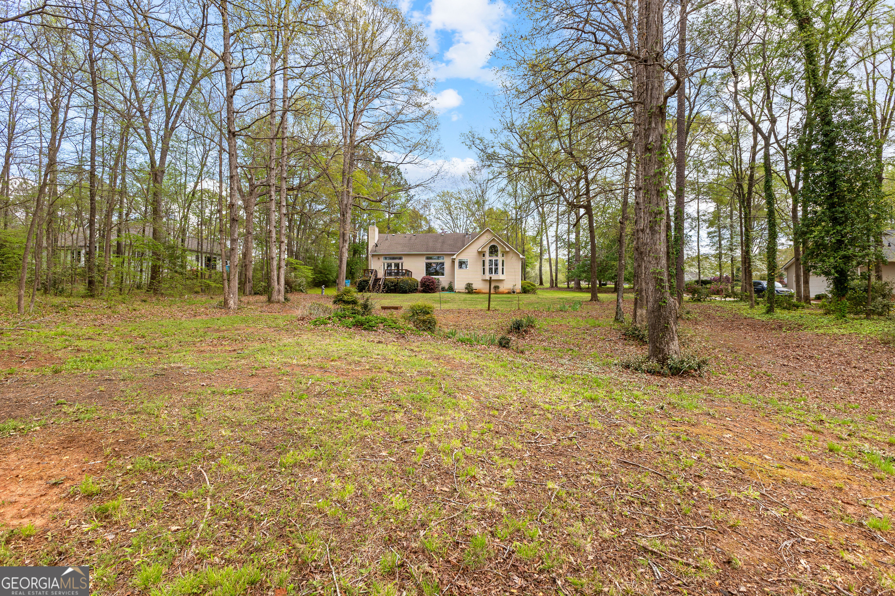 65 Pointe View Court Jackson, GA 30233 - Photo 37 of 39 a backyard of apartments with large trees