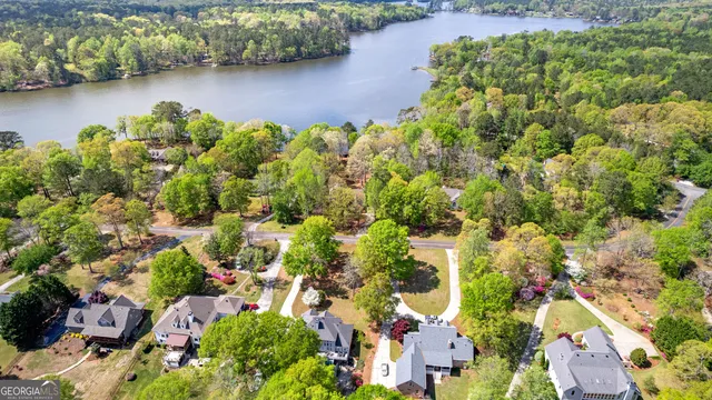 an aerial view of residential house with outdoor space and lake view