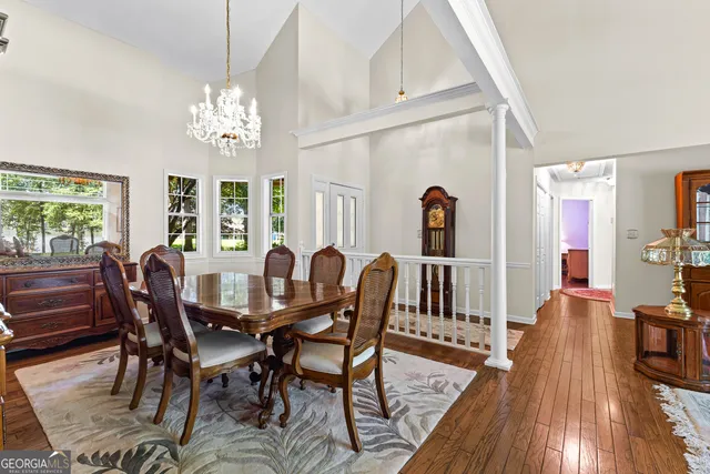 a view of a dining room with furniture window and wooden floor