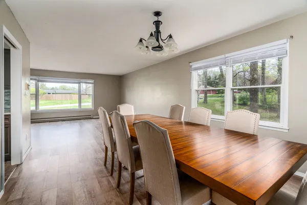 a view of a dining room with furniture window and wooden floor