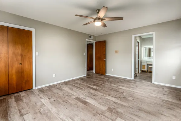 a view of a livingroom with a chandelier fan