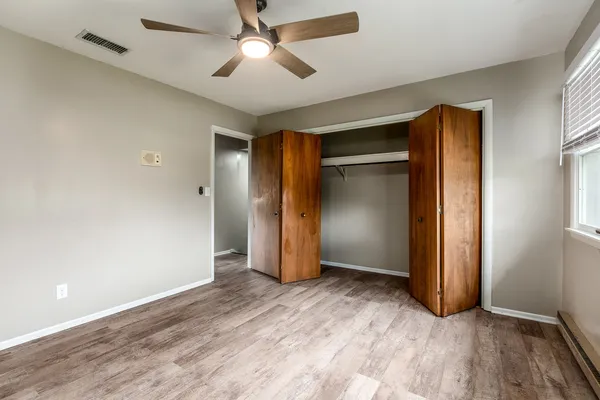 a view of a balcony with wooden floor