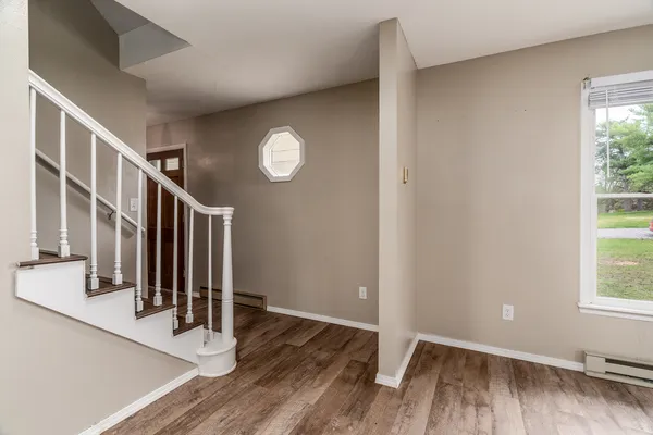 a view of entryway with wooden floor