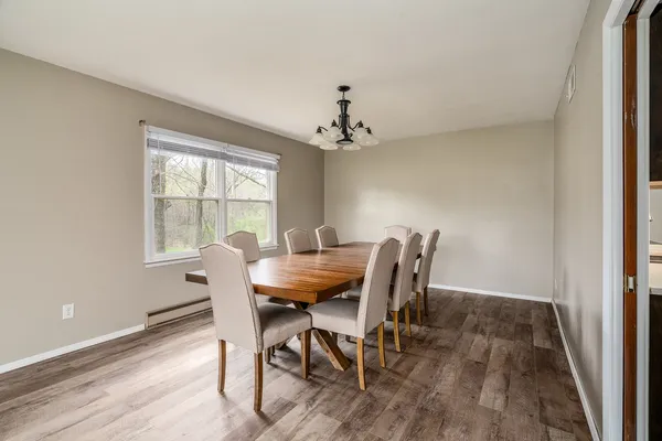a view of a dining room with furniture window and outside view
