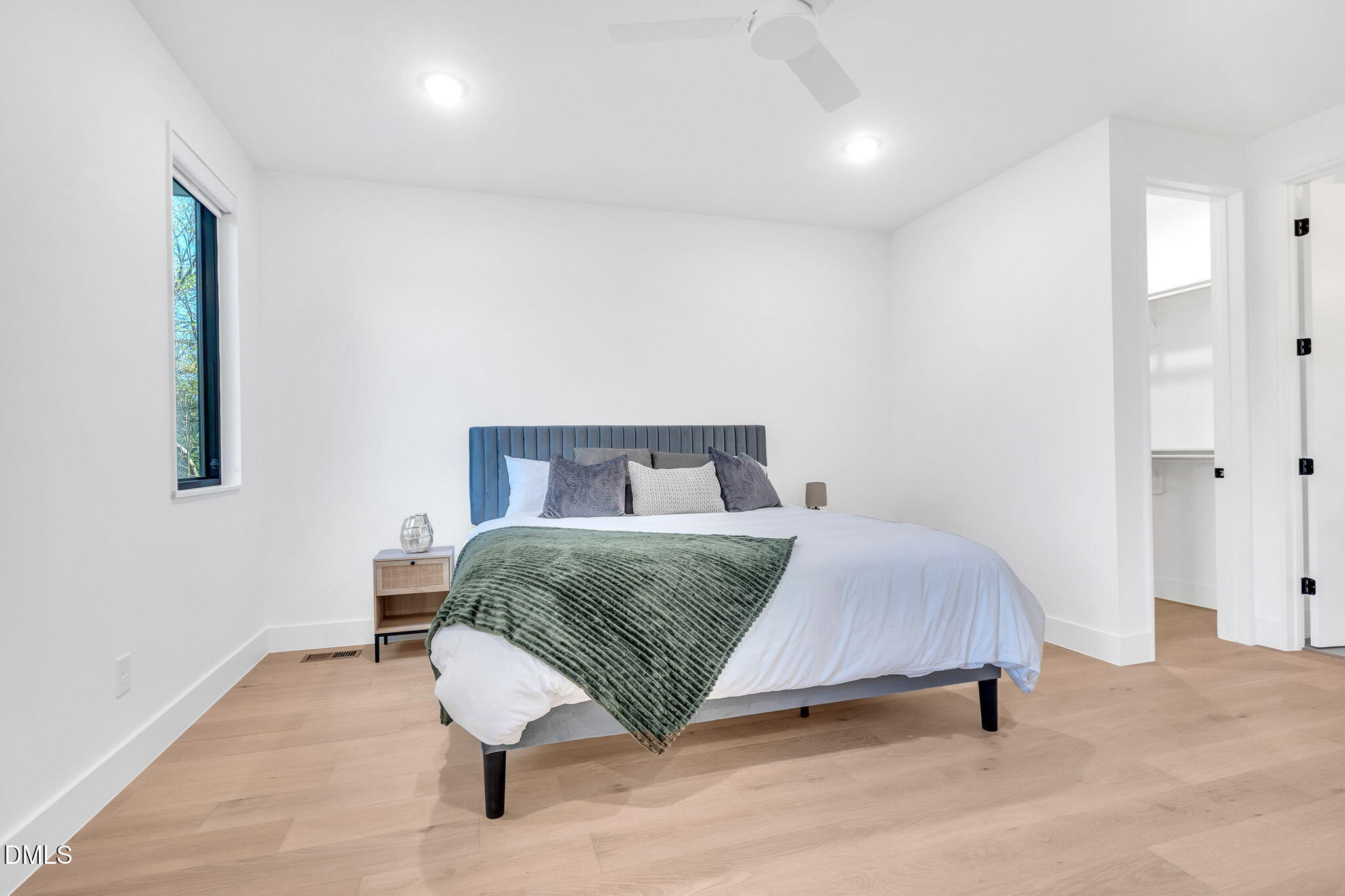 810 Culpepper Lane Raleigh, NC 27610 - Photo 15 of 31 a bedroom with a bed and a table
