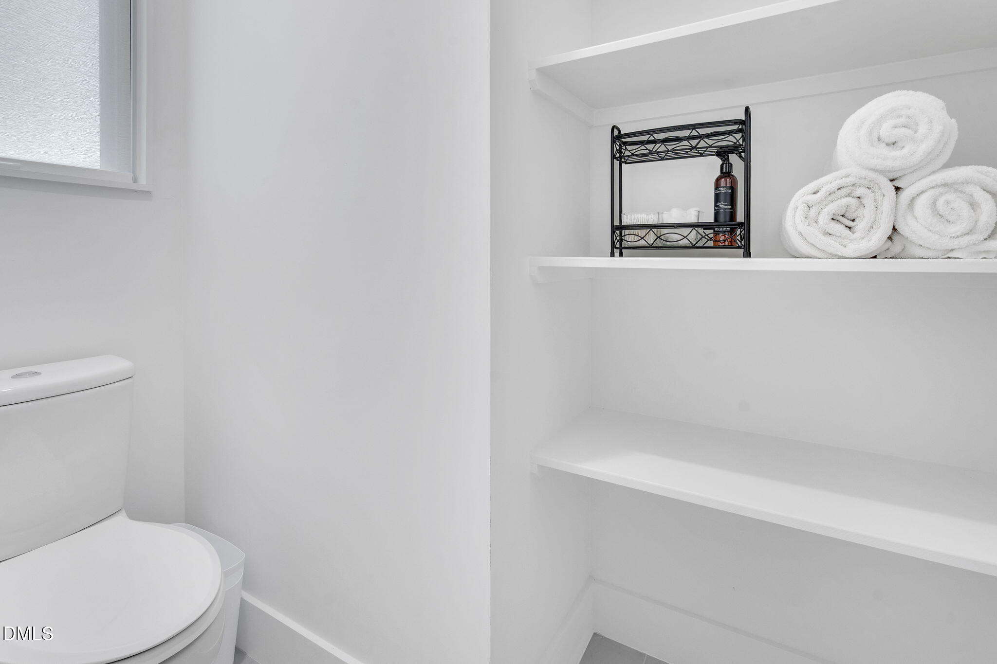 810 Culpepper Lane Raleigh, NC 27610 - Photo 19 of 31 a white toilet sitting next to a white wall