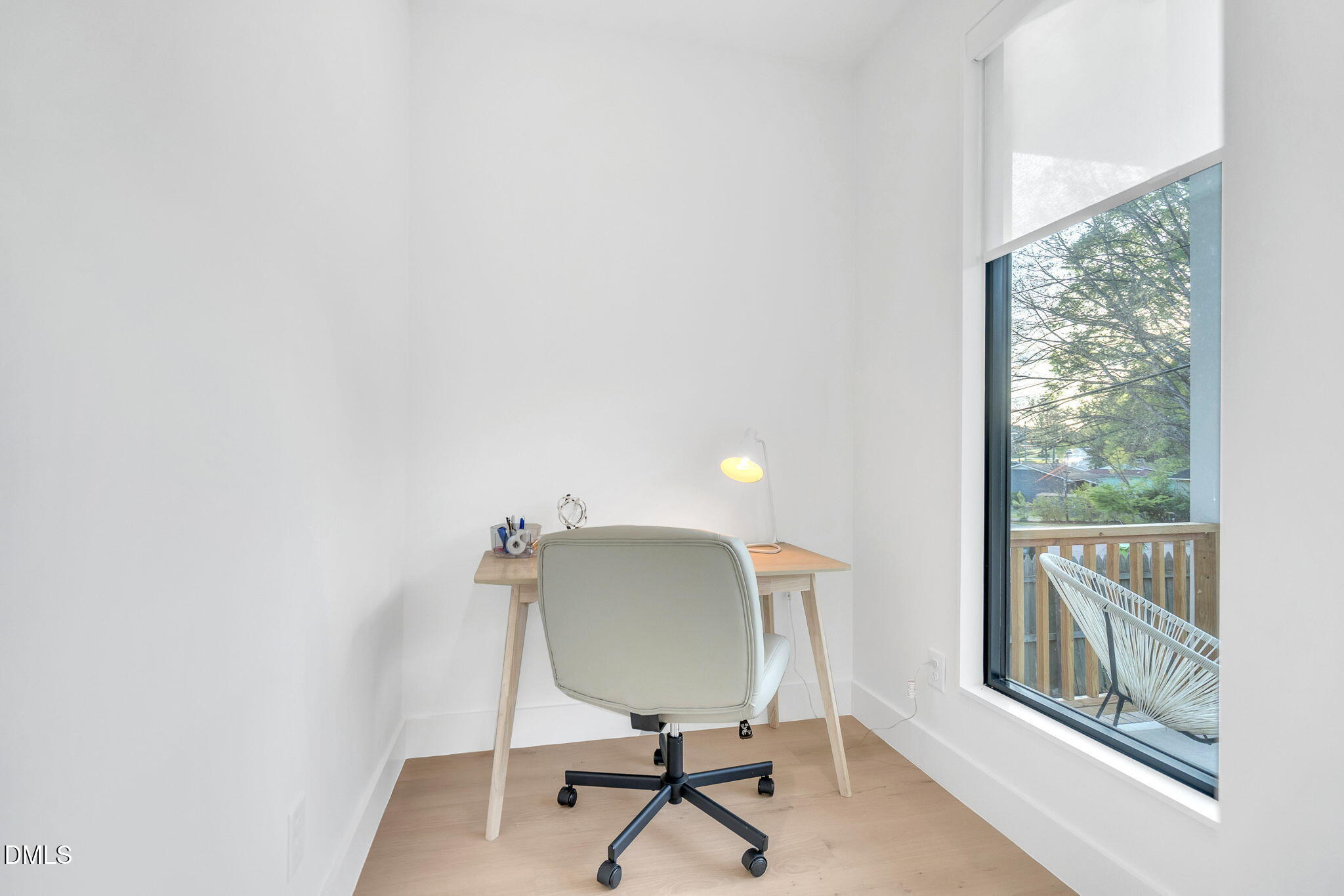 810 Culpepper Lane Raleigh, NC 27610 - Photo 5 of 31 a view of a workspace with furniture and a window