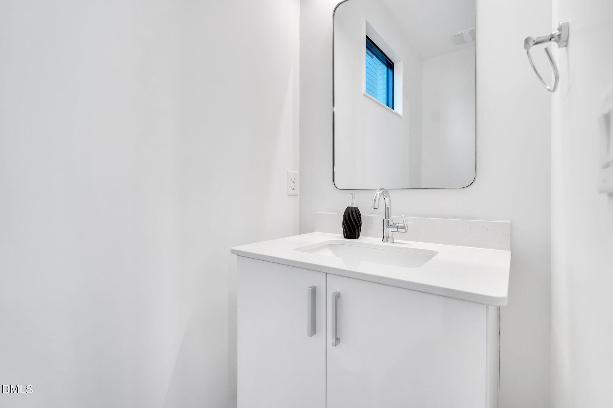 810 Culpepper Lane Raleigh, NC 27610 - Photo 10 of 31 a bathroom with a sink and mirror