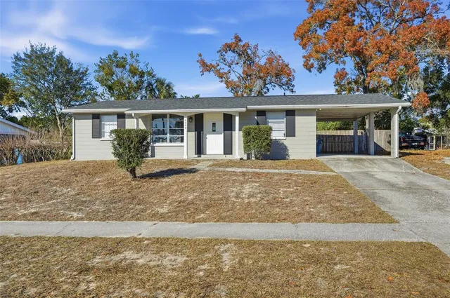 front view of a house with a yard