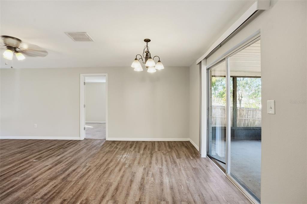 9543 Century Drive Spring Hill, FL 34608 - Photo 12 of 25 wooden floor in an empty room with a window