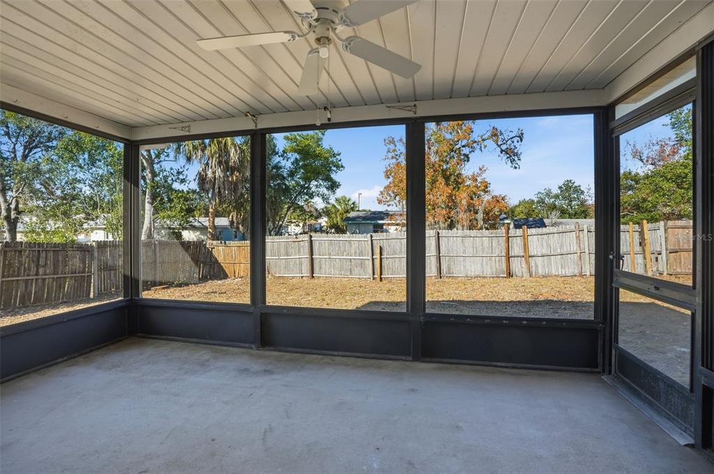 9543 Century Drive Spring Hill, FL 34608 - Photo 23 of 25 an empty room with large windows