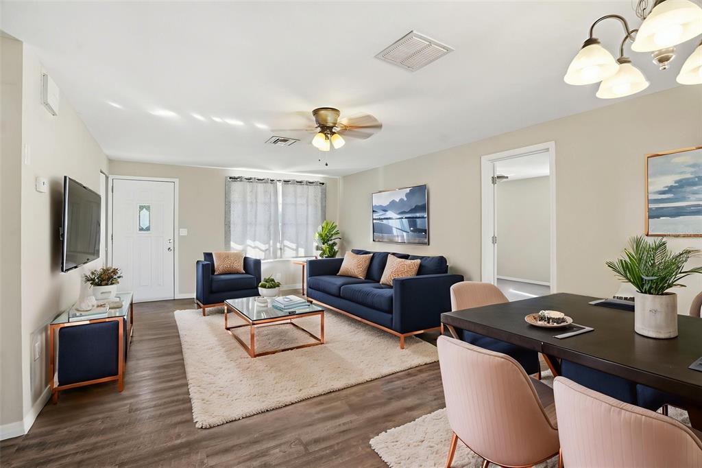 9543 Century Drive Spring Hill, FL 34608 - Photo 5 of 25 a living room with furniture potted plant and wooden floor