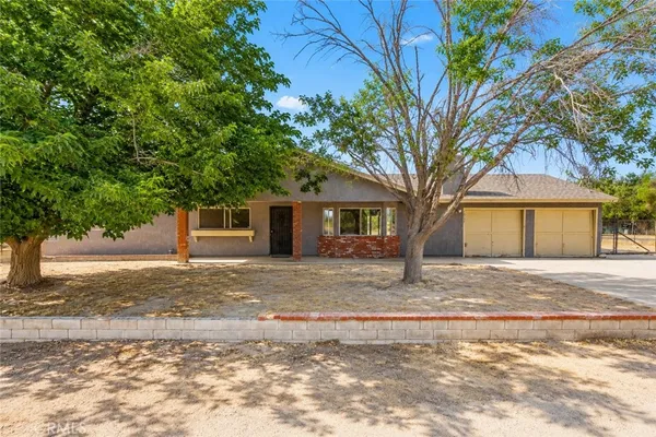 a house with trees in the background