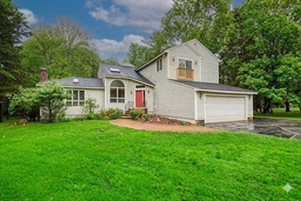 7 Tisdale Road Sharon, MA 02067 - Photo 36 of 37 a front view of a house with a garden and yard