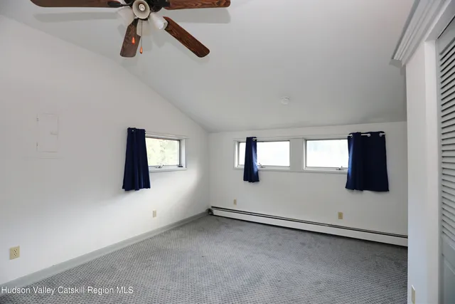 a view of room with window and ceiling fan