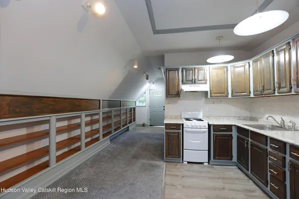 a kitchen with stainless steel appliances a sink and cabinets