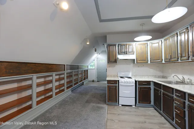 a kitchen with stainless steel appliances a sink and cabinets