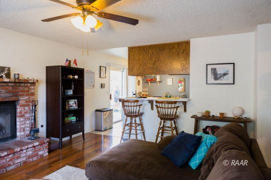 220 South Gemstone Street Ridgecrest, CA 93555 - Photo 9 of 12 a view of a livingroom with furniture and staircase