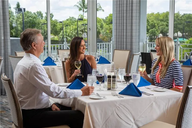 a view of living room with furniture and floor to ceiling windows