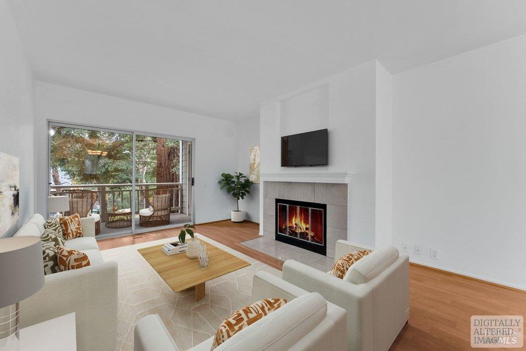 135 Koch Road Corte Madera, CA 94925 - Photo 1 of 57 a living room with furniture a flat screen tv and a fireplace