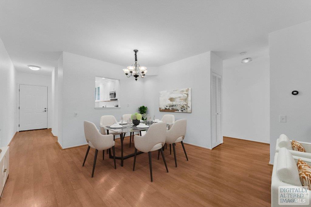 135 Koch Road Corte Madera, CA 94925 - Photo 13 of 57 a view of a dining room with furniture and wooden floor
