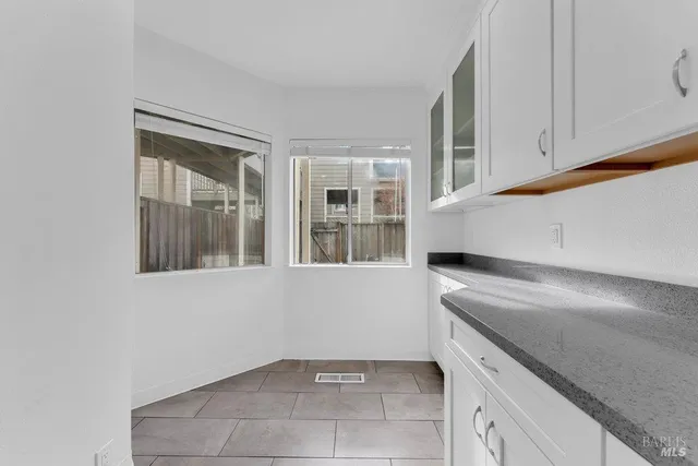 a kitchen with a sink stove and microwave