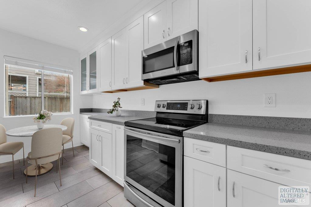 135 Koch Road Corte Madera, CA 94925 - Photo 18 of 57 a kitchen with a sink stove and microwave