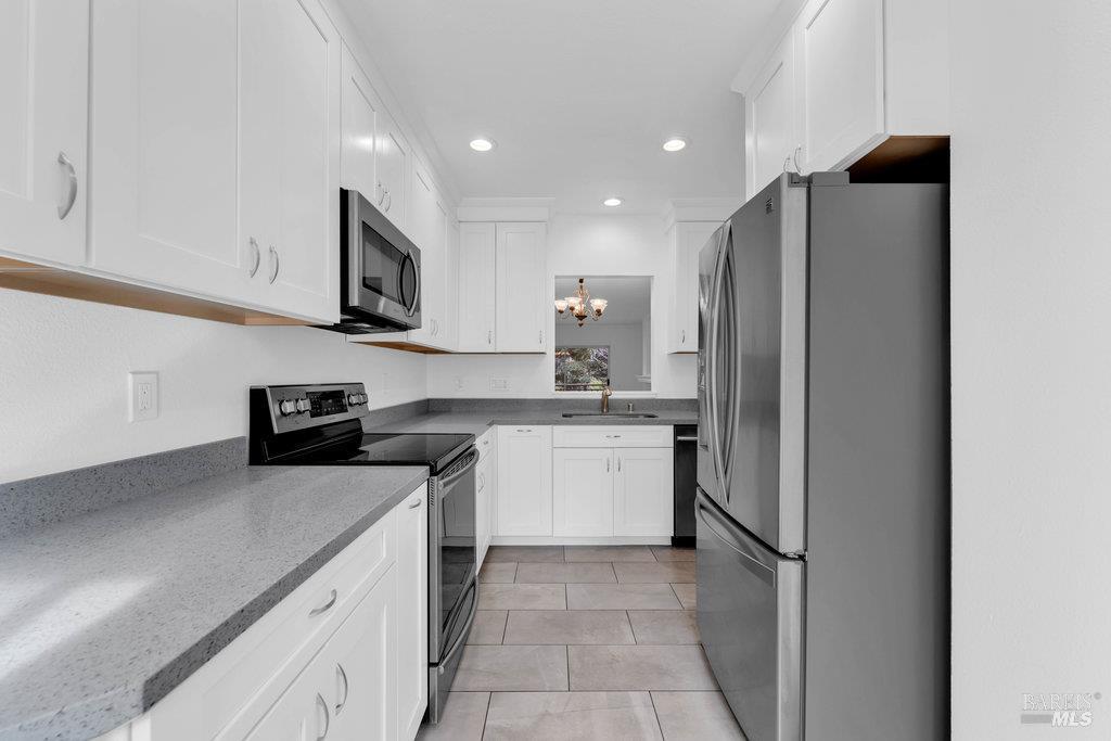 135 Koch Road Corte Madera, CA 94925 - Photo 20 of 57 a kitchen with a refrigerator and a sink