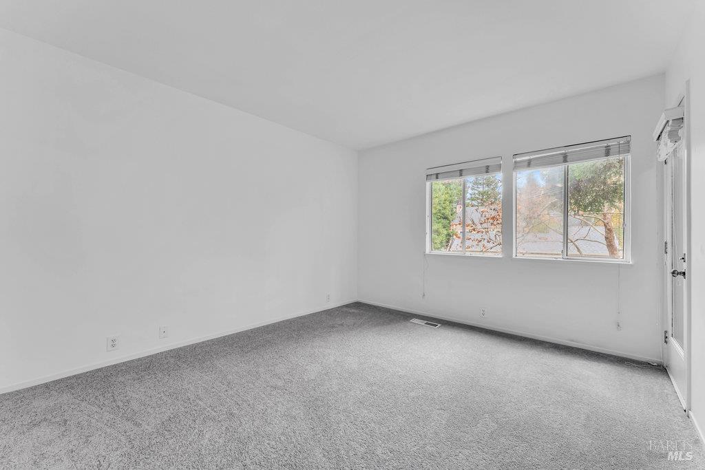 135 Koch Road Corte Madera, CA 94925 - Photo 27 of 57 an empty room with windows