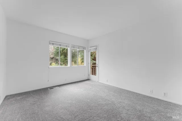 a bathroom with a toilet and bathtub