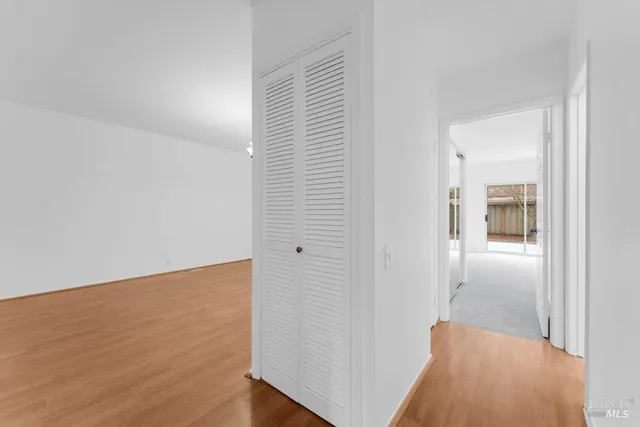 a bedroom with a balcony a large bed and a couch