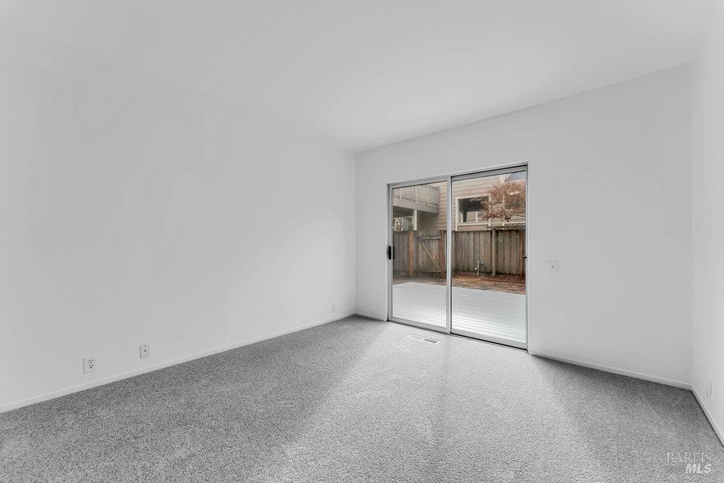135 Koch Road Corte Madera, CA 94925 - Photo 40 of 57 a view of an empty room with a window