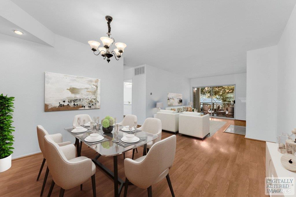 135 Koch Road Corte Madera, CA 94925 - Photo 6 of 57 a view of a dining room with furniture wooden floor and a chandelier